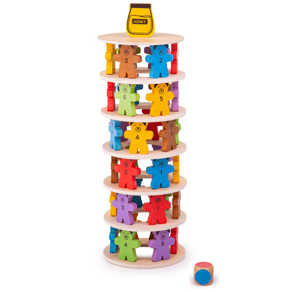 Front view of Tumbling Teddies wooden stacking game with numbered colorful bear pieces and honey pot topper on white