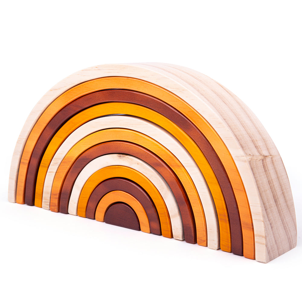Angled view of the Large Natural Wooden Stacking Rainbow showcasing seven warm toned wooden arches on a white background