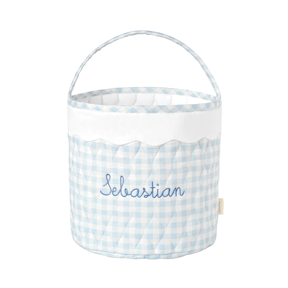 Blue gingham quilted bucket-style basket with scalloped trim and handle.