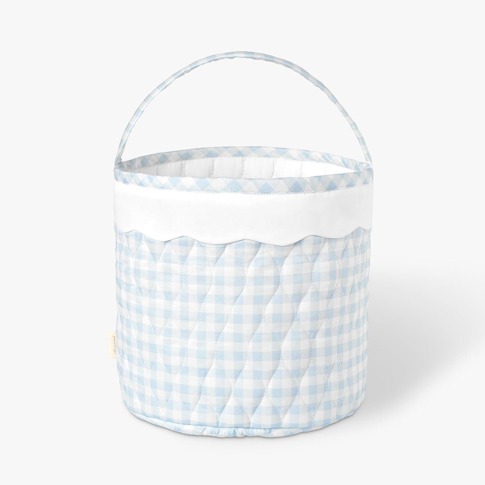 Quilted basket with blue and white checkered pattern on a white background