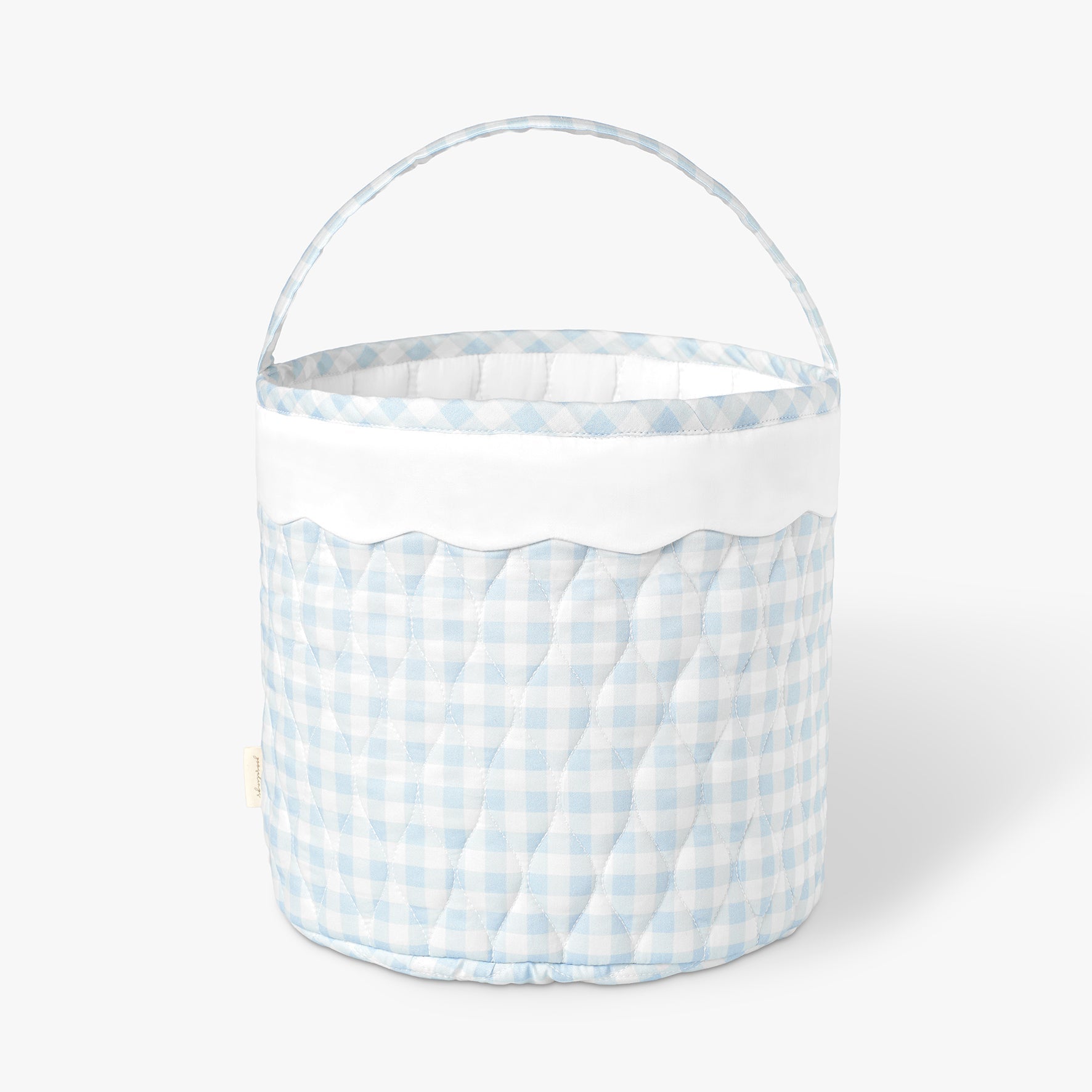 Quilted basket with blue and white checkered pattern on a white background