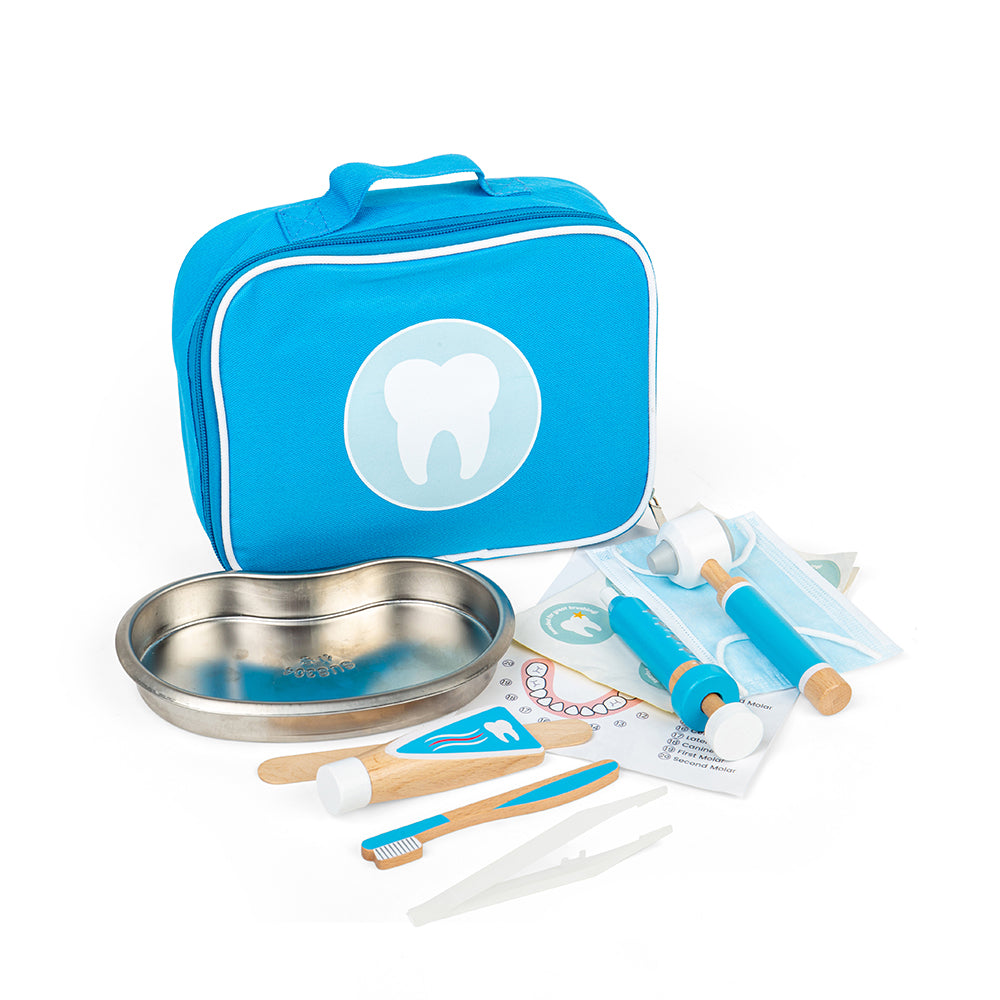 Front of wooden dentist play set with blue carry bag and tooth logo, metal tray and wooden tools on white background