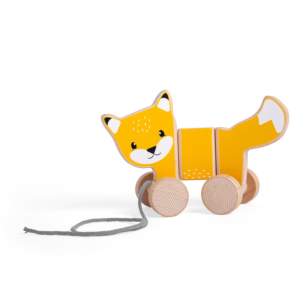 Three-quarter view of the Pull Along Fox showcasing orange coat, patterned wheels, and grey pull cord on white background