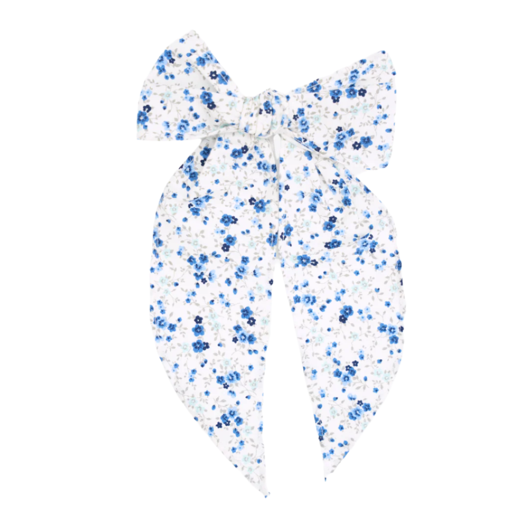 Front view of Emmie Bow hair bow showcasing blue floral print and long tails on white background