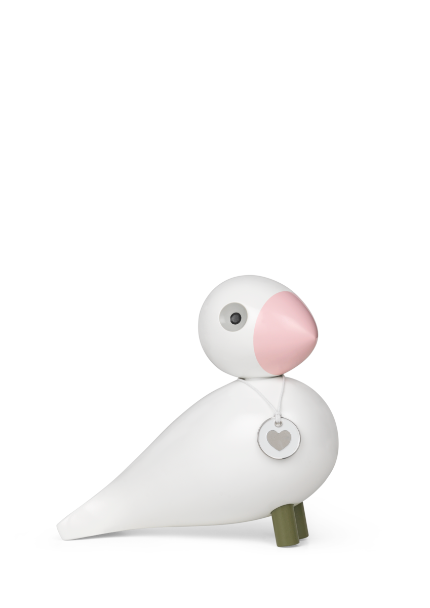 Side view of Songbird Hope in White and Rose showcasing a white beech body, rose face, and heart pendant on a plain background