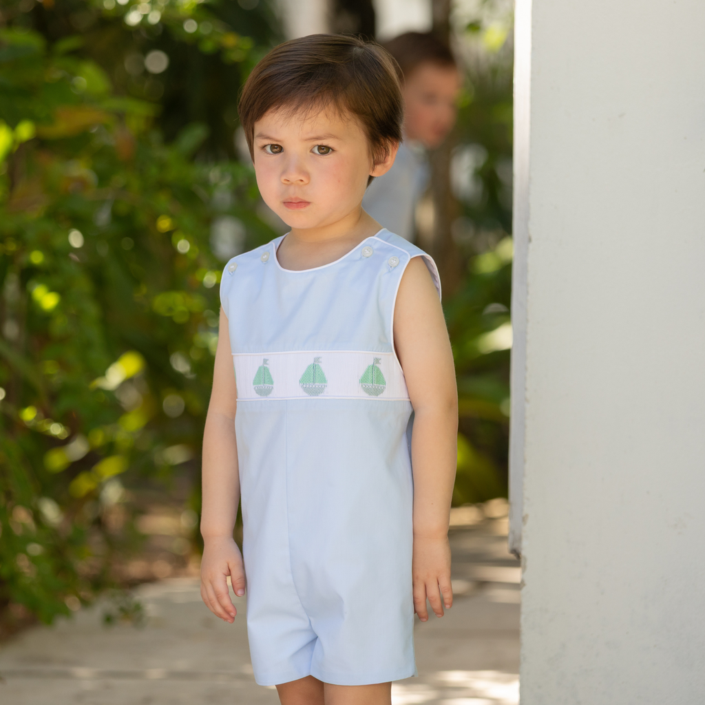 Henry Duvall Jennings Jon Jon in Bailey’s Bay Blue cotton with hand-smocked sailboats, classic heirloom baby boy summer outfit