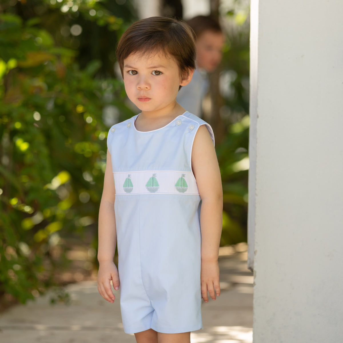 Henry Duvall Jennings Jon Jon in Bailey’s Bay Blue cotton with hand-smocked sailboats, classic heirloom baby boy summer outfit