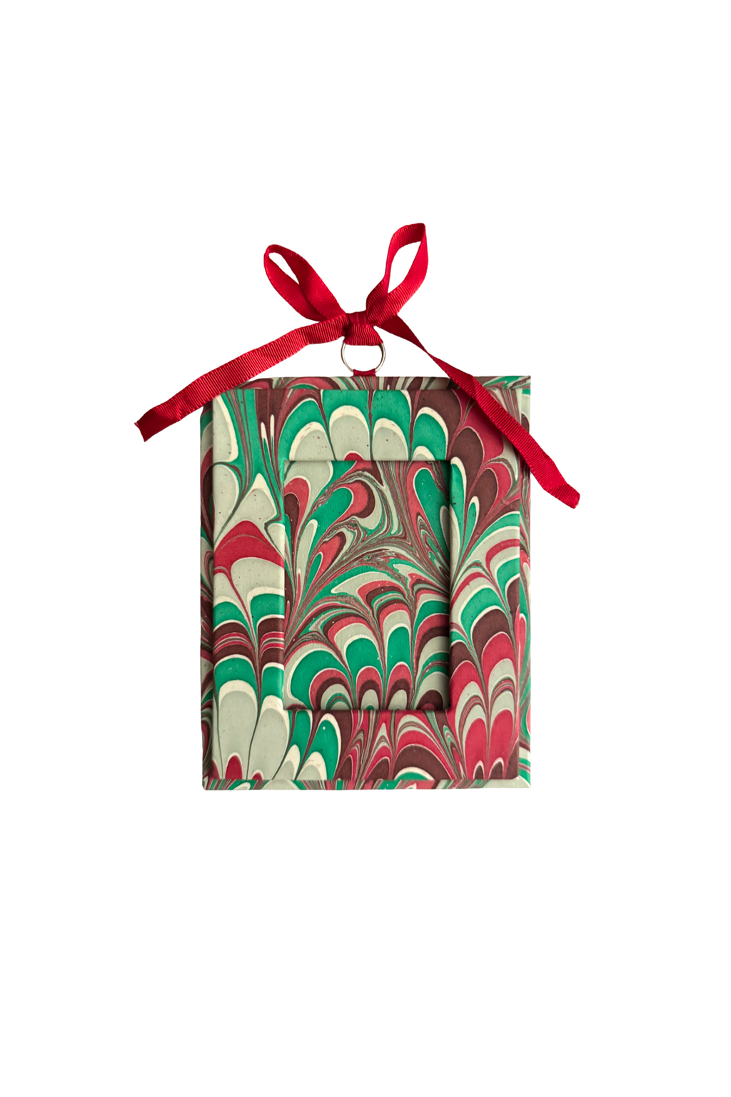 Festive marble-patterned holiday picture frame ornament with red ribbon bow