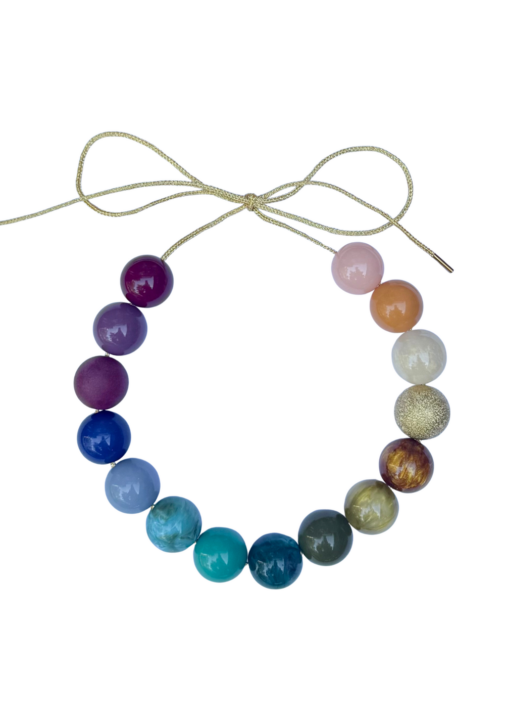 Top view of Central Park Bubble Necklace with multicolored round beads and adjustable gold lurex cord on white background
