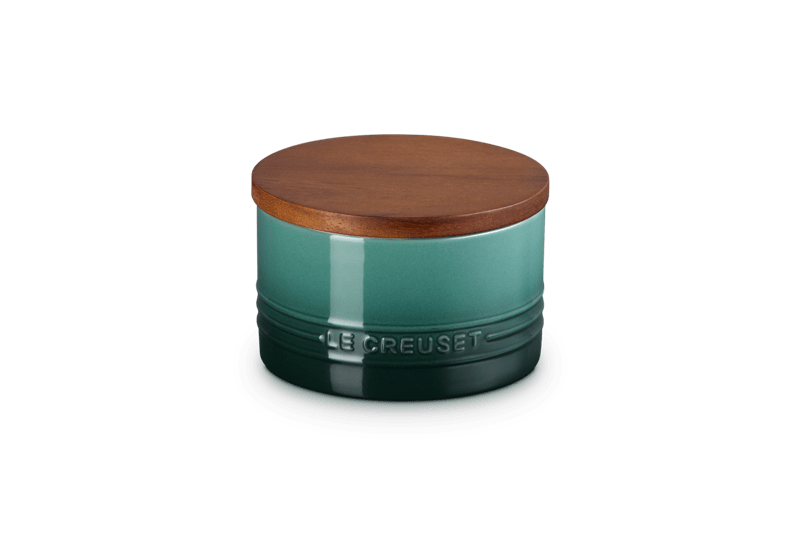 Angled view of Signature Storage Canister in Artichaut 16 oz showing enamel finish and wood lid on white background