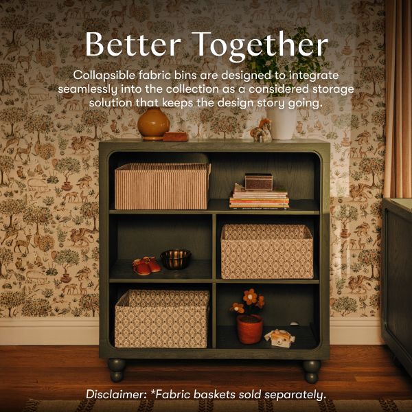 Astre bookcase styled with fabric bins and books in a floral room with Better Together headline