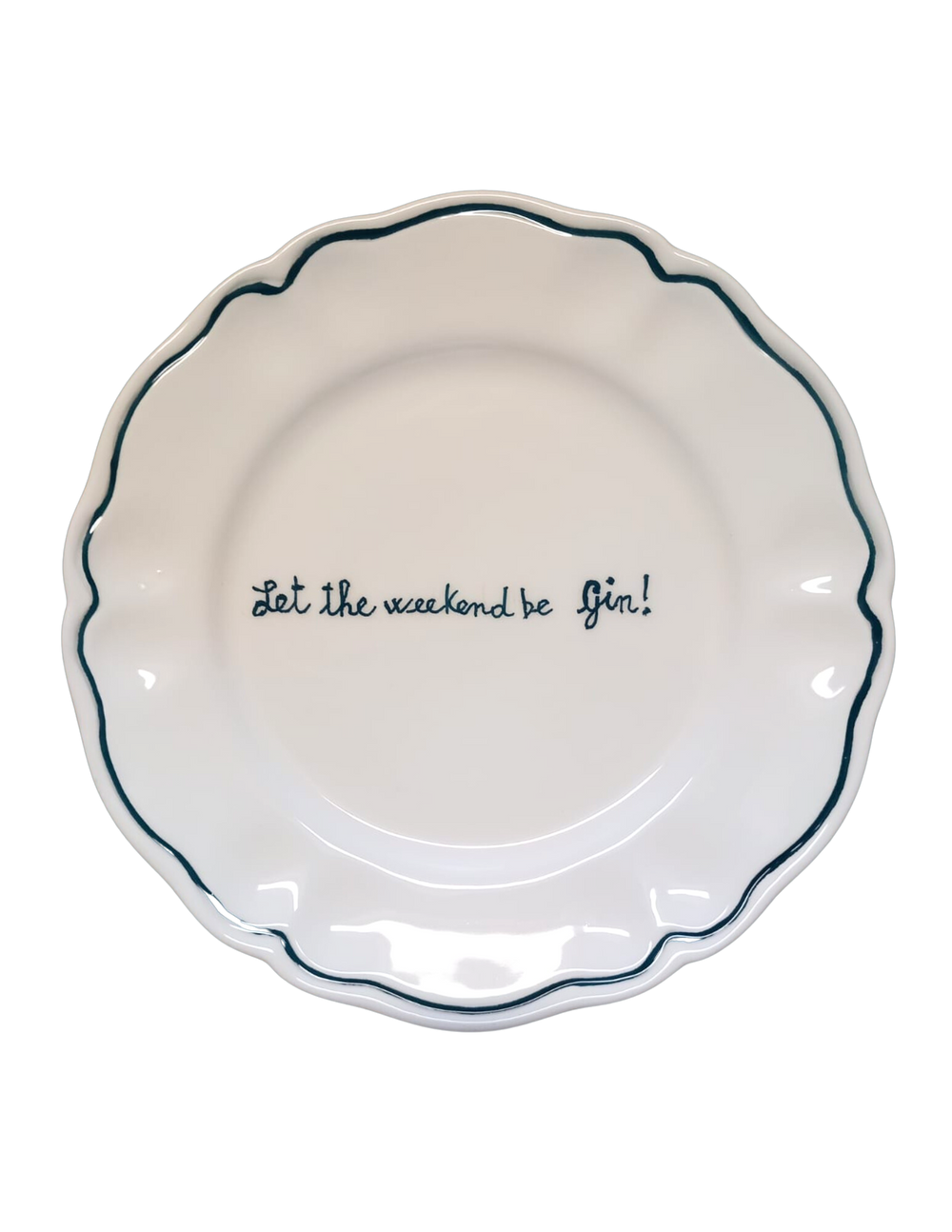 Top view of scalloped white ceramic plate with dark green rim and handwritten text ‘Let the weekend be Gin!’