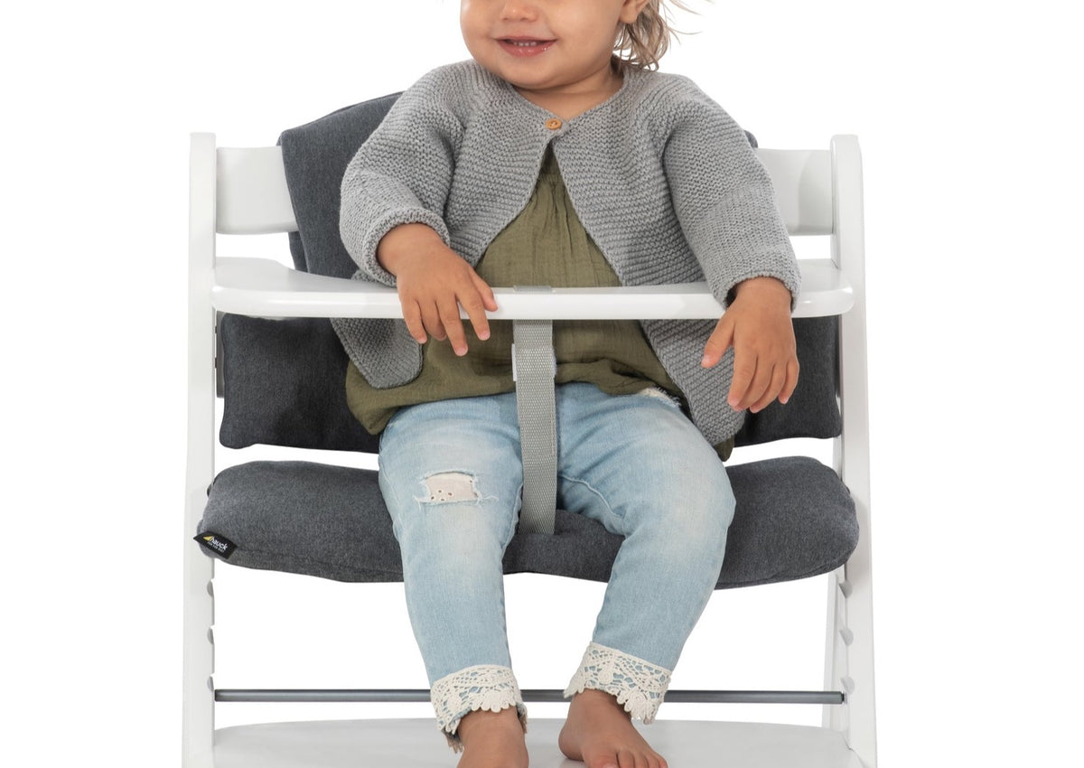 Front view of Alpha Highchair Pad Deluxe Seat Cushion with charcoal padding, high back, and side supports on white high chair