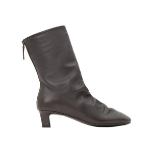 Side view of the Ariel brown nappa leather ankle boot showcasing its kitten heel and rear zip closure on a white background