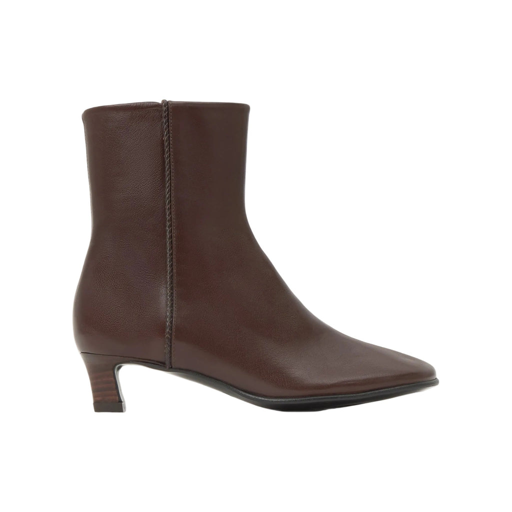 Side view of Aldo Buffalo Nappa ankle boot showcasing brown leather and kitten heel with white background