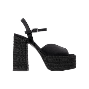 Side view of Fede black satin platform heeled sandal showcasing ankle strap and braided heel against a white background