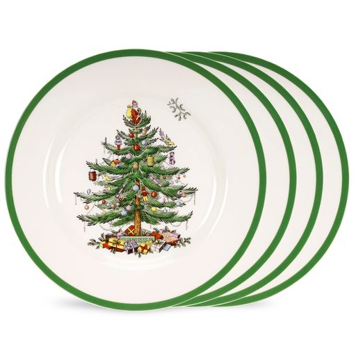 Angled view of Spode Christmas Tree 8-inch salad plates set of 4 showcasing central Christmas tree motif and green rim on white background