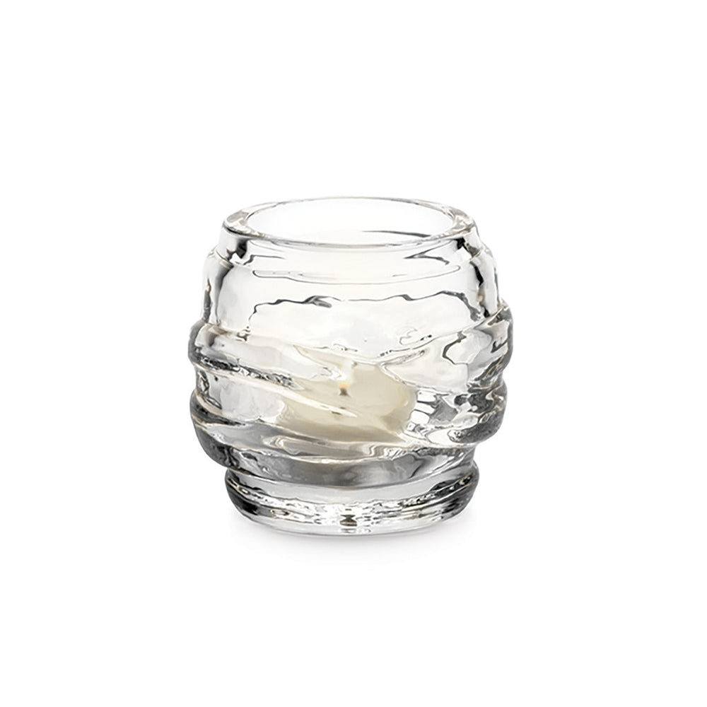 Front view of Waterbury tealight showcasing layered rippled clear glass with a small white candle on a white background