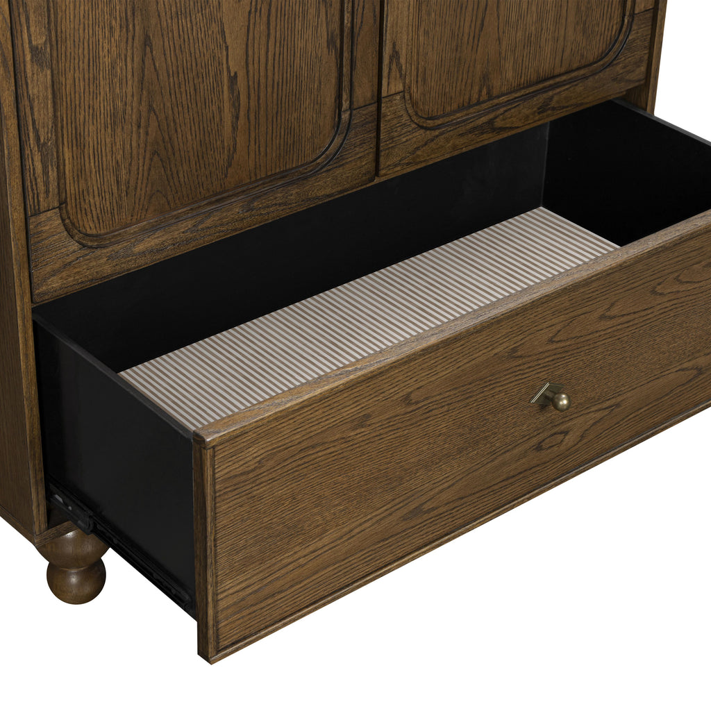 Close-up of Astre Assembled Armoire by Nate Berkus in Toffee showcasing open drawer, striped interior, and brass knob