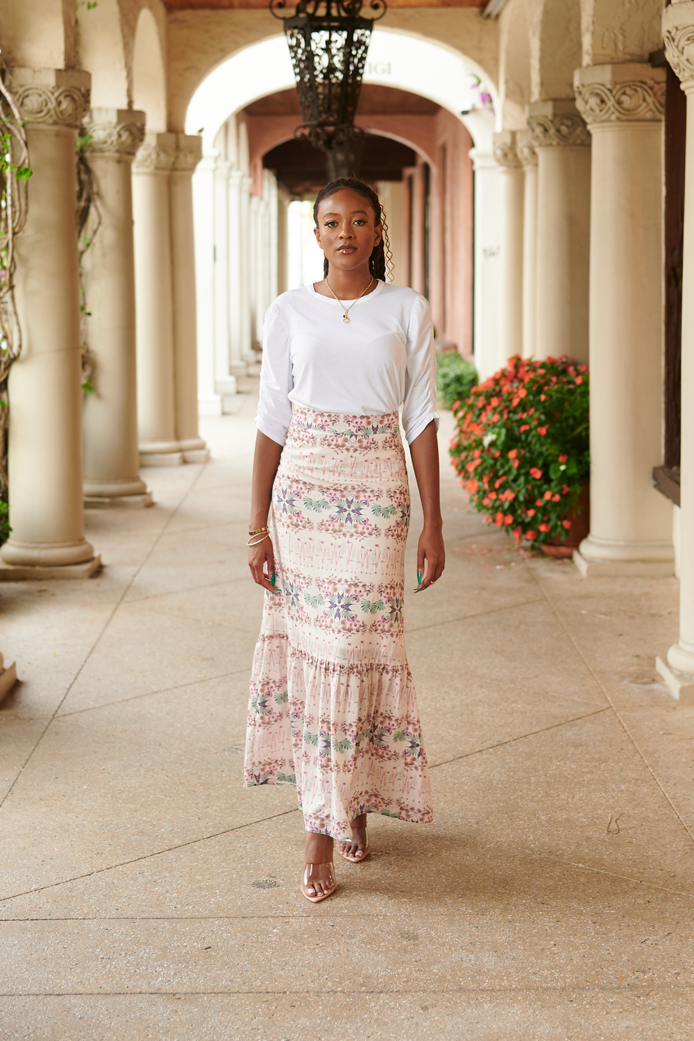 Front view of Lizzie linen skirt in Breakfast in the Park print showing high waist and floor-grazing length on model in arched colonnade
