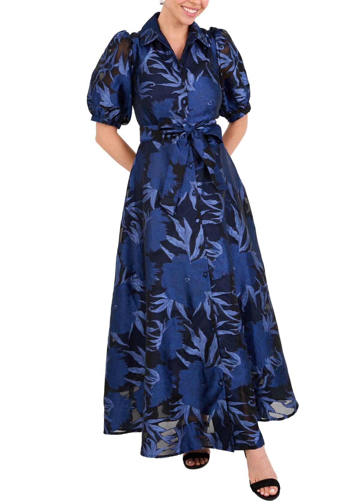 Front view of Charlotte Gown in Royal Blue Pansy Vine Organza showcasing collared neckline and self tie belt on model