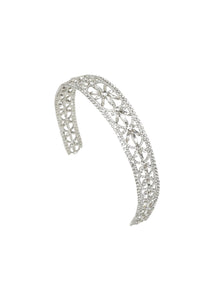 Angled view of Epoch Headband in Crystal showcasing fine crystals and starlight and floral motifs against a white background