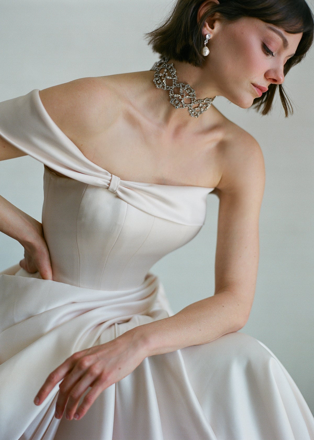 Three-quarter view of Lavinia Ribbon Tie choker in Crystal Cream showing Austrian crystal mesh with silk ribbon tie on a model