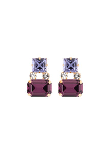 Front view of Nanette Earrings in Tanzanite showcasing princess-cut and emerald-cut Austrian crystals on a white background