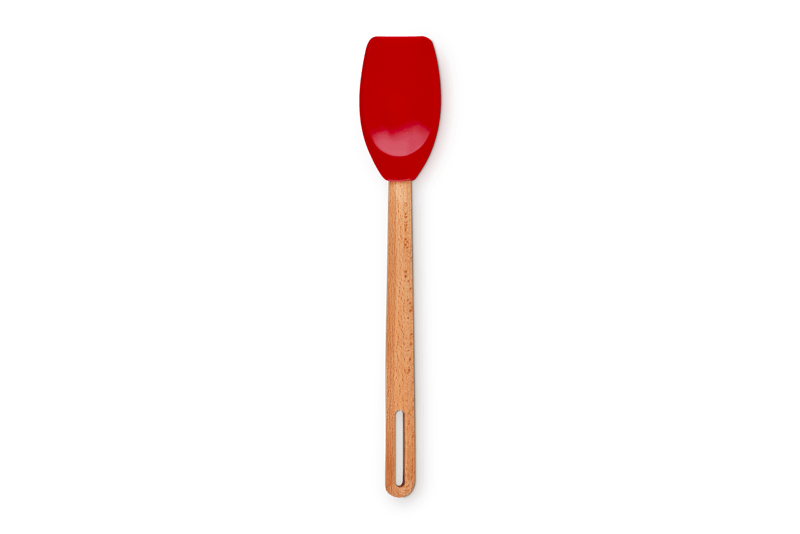 Overhead view of Signature Silicone Spatula Spoon showcasing Cerise silicone head and FSC-certified beech wood handle on light green background