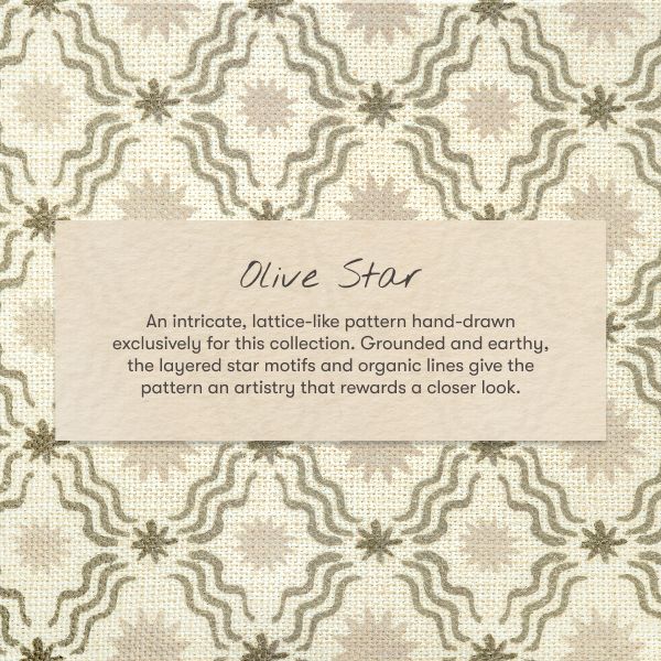 Close-up of the mini crib sheet showcasing the Olive Star lattice pattern with an ivory background
