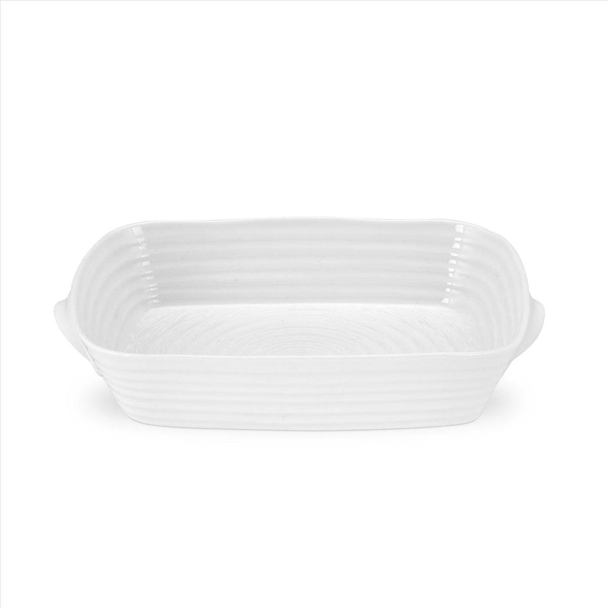 Angled view of Sophie Conran Small Handled Rectangular Roasting Dish showcasing white porcelain and integrated side handles with a white background
