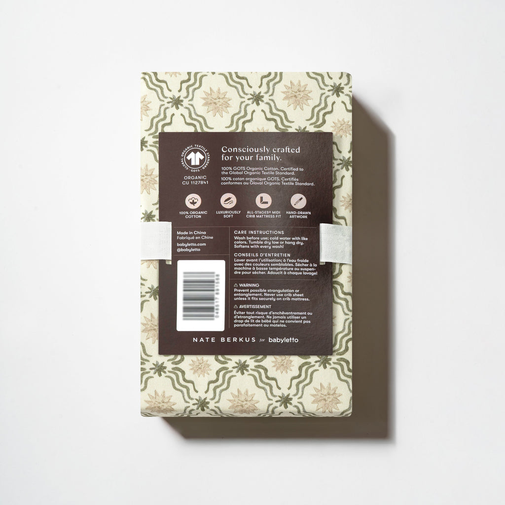 Back view of All Stages Midi Crib Sheet packaging showing Juniper Star pattern and product details on a white background