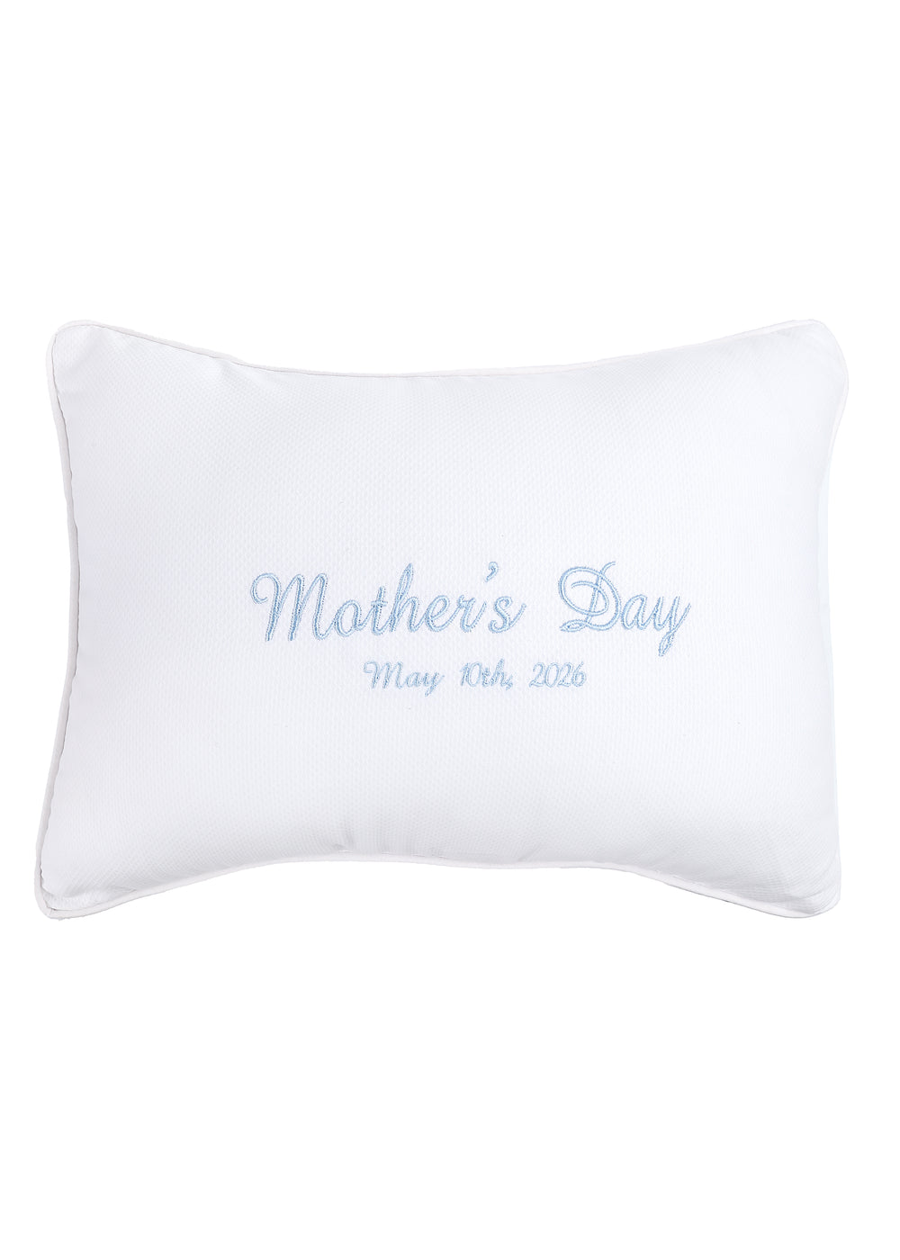 Front view of white rectangular personalization pillow with light blue embroidered Mothers Day and May 10th 2026, pique piping