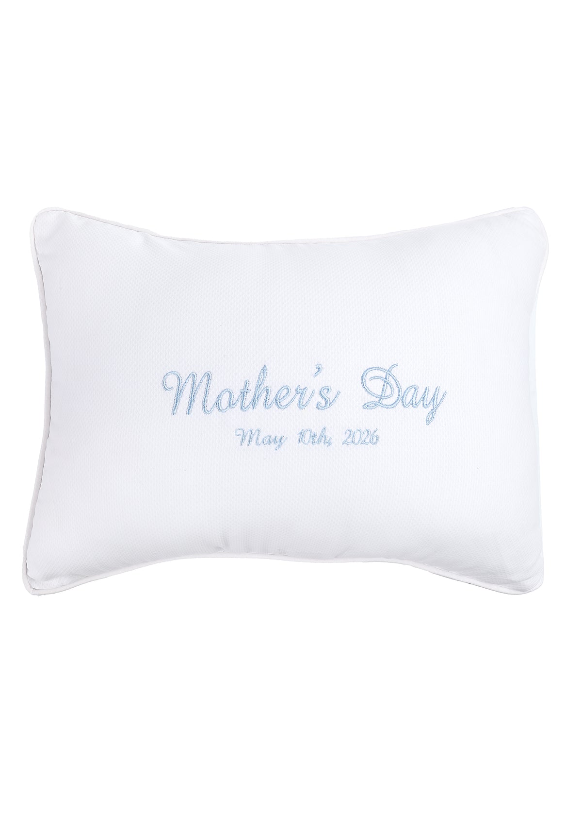 Front view of white rectangular personalization pillow with light blue embroidered Mothers Day and May 10th 2026, pique piping