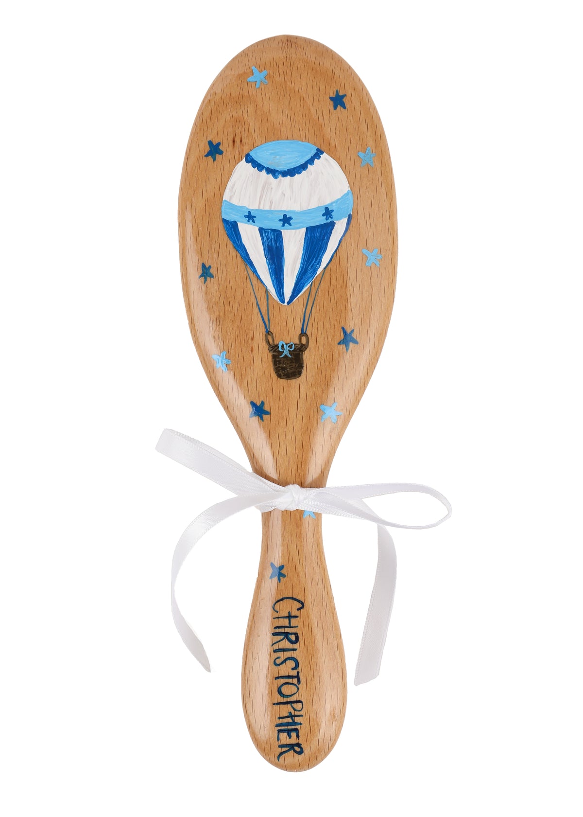 Top view of beechwood hairbrush with hand-painted blue hot air balloon and personalization ‘Christopher’ on handle