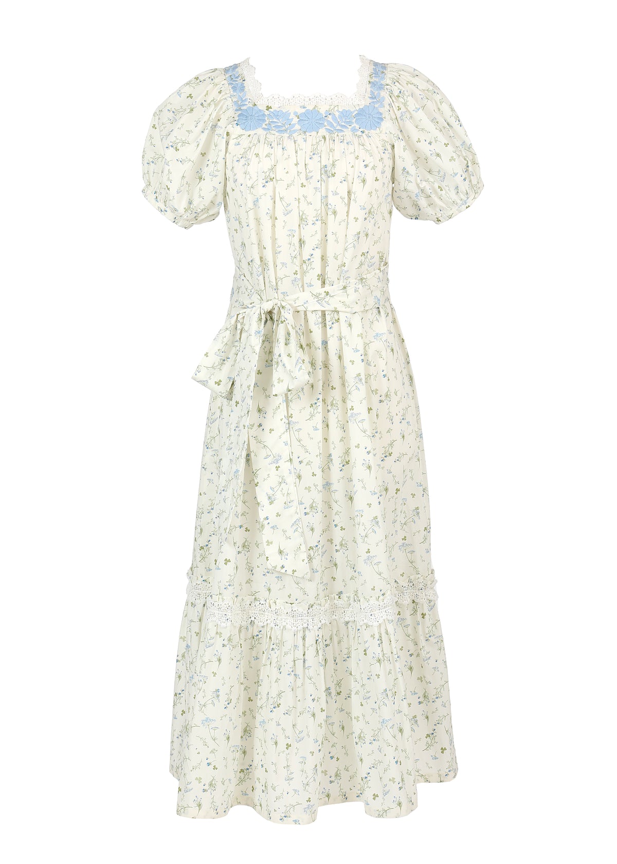 Front view of OTM Exclusive Maria Dress showcasing blue floral embroidery, puff sleeves, lace trim, and tied sash on white background