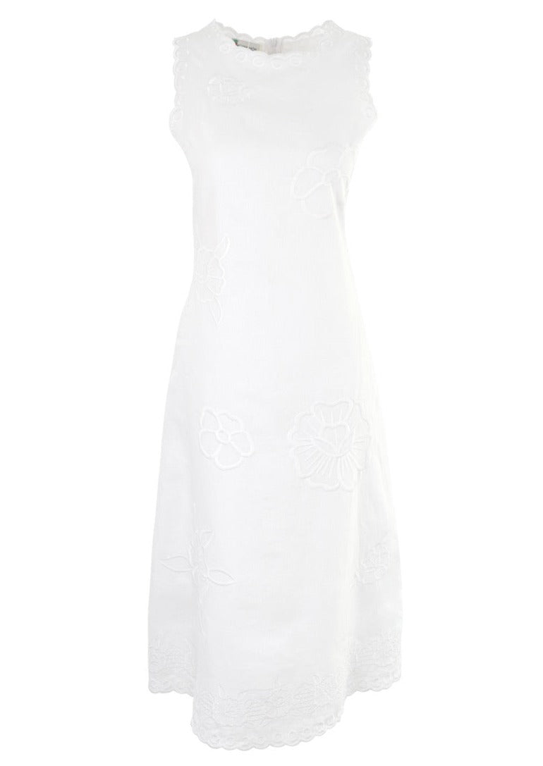 Front view of Vera midi dress with sleeveless A line, floral eyelet embroidery and scalloped hem on white background