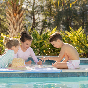 Classic boys’ swim trunks by Henry Duvall in a tailored above-the-knee fit with UPF 50+ protection, featuring an elastic waistband and drawstring for a comfortable summer look.