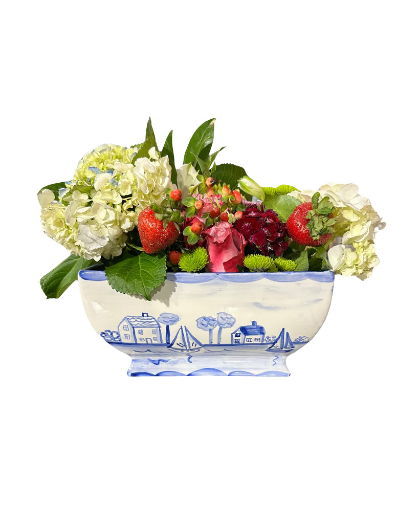 Front view of Nantucket Planter with hand-painted blue-and-white seaside cottages and mixed flowers on a white background
