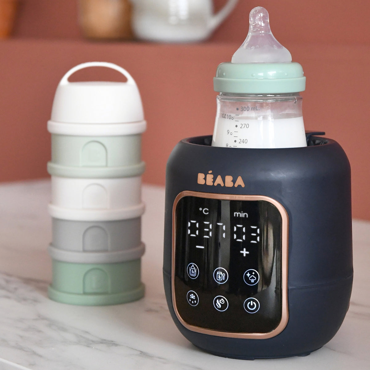 Front view of Milk Baby Bottle & Jar Warmer in Midnight with digital touch screen and baby bottle on a marble counter