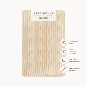 Front view of Autumn Stripe mini crib sheet in GOTS certified organic brushed cotton with feature callouts on a white background