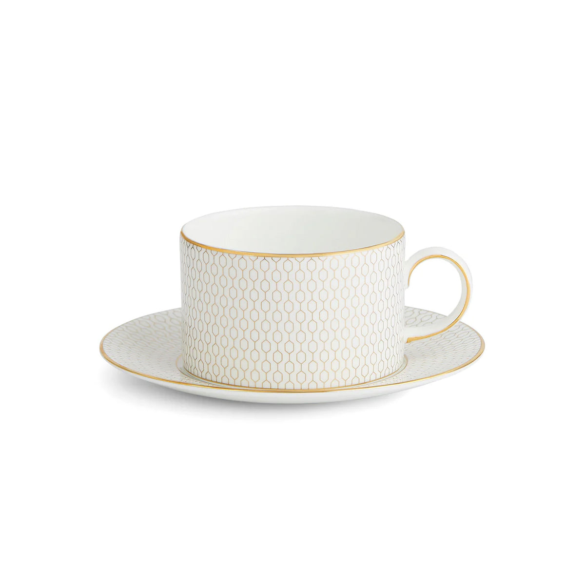 Front view of Gio Gold Teacup & Saucer Set showcasing embossed geometric pattern and gold trim with a white background