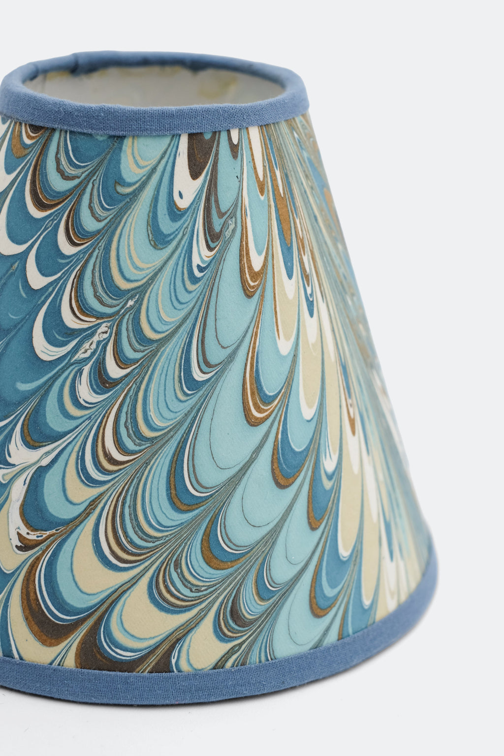Nila Feathers hand-marbled clip-on lampshade close-up with swirling patterns