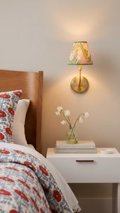 Inner Child's peony bloom hand-marbled clip-on sconce mounted on wall