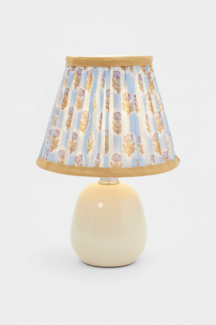 Illuminated sky blue daisy pleated lamp on cream base - Inner Child