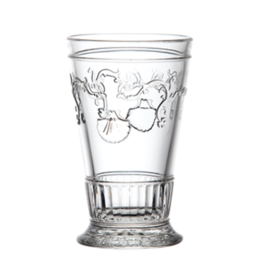 Front view of Versailles ice tea glass showcasing shell and flower engraving and faceted skirt base on white background