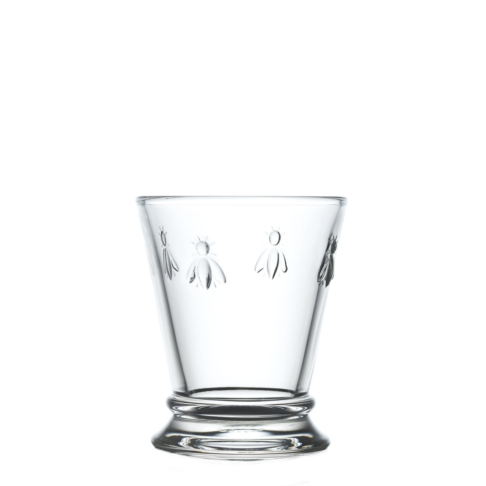 Front view of Bee mini tumbler showcasing embossed bee motif on clear glass with white background