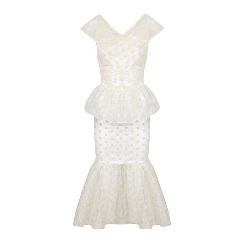 Front view of Clemence set in organza polka dot showcasing peplum waist and fitted skirt with flared mermaid hem on white background