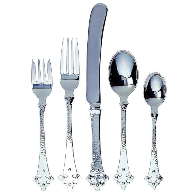Front view of Celtic flatware set showing hammered 18-10 stainless steel and ornate Celtic handles on white background