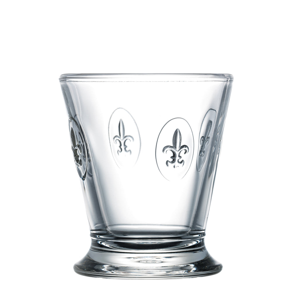 Front view of Fleur de Lys glass tumbler showcasing embossed fleur-de-lys medallions and weighted skirted base on white background